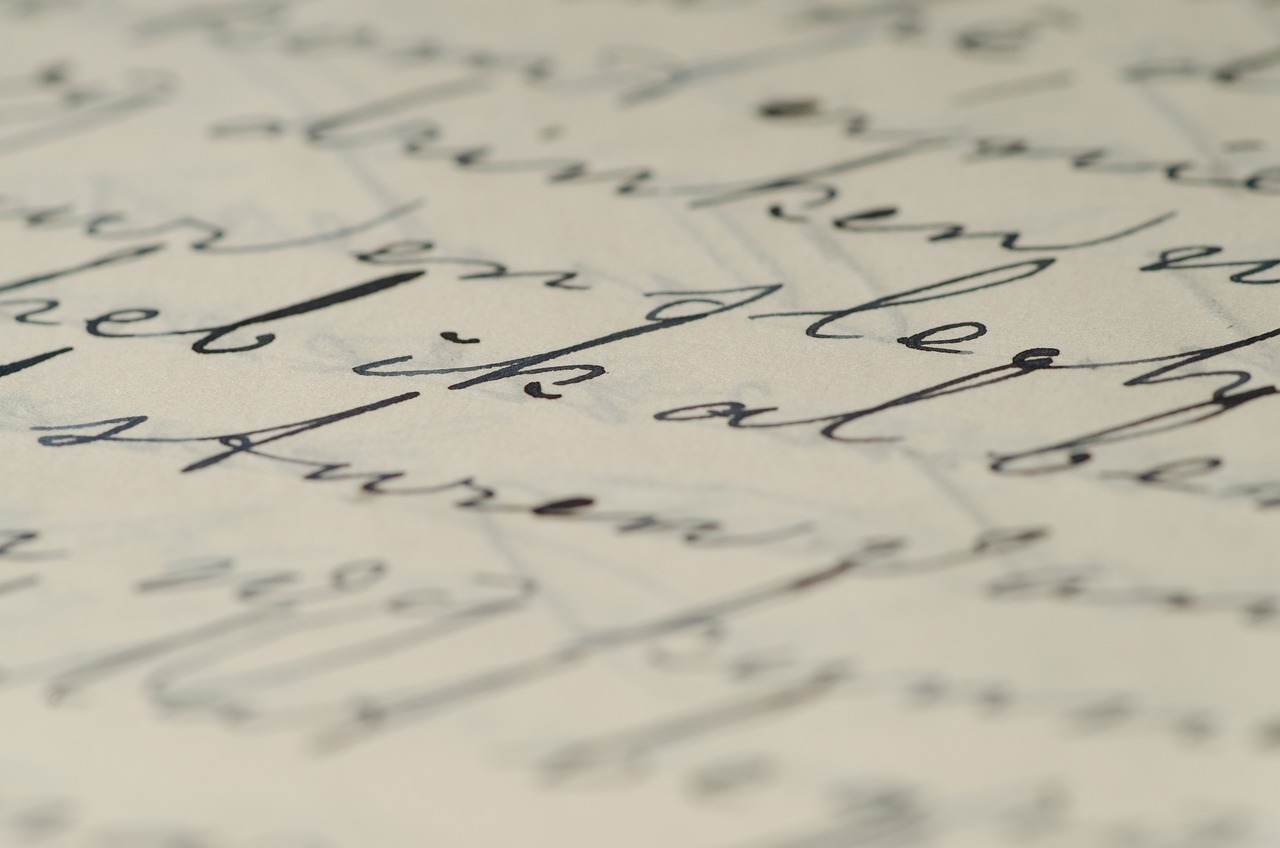 Close-up of handwriting on a piece of paper.